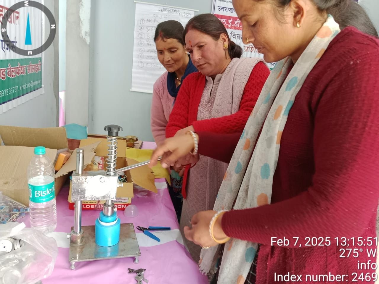 Women assembling LED bulbs in a livelihood training session