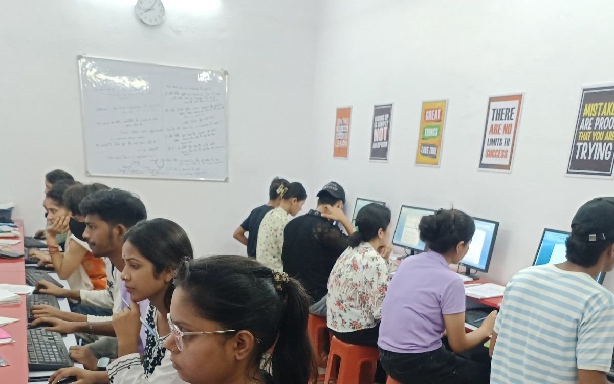 Trainees at workstations during a data entry operator course in a computer laboratory